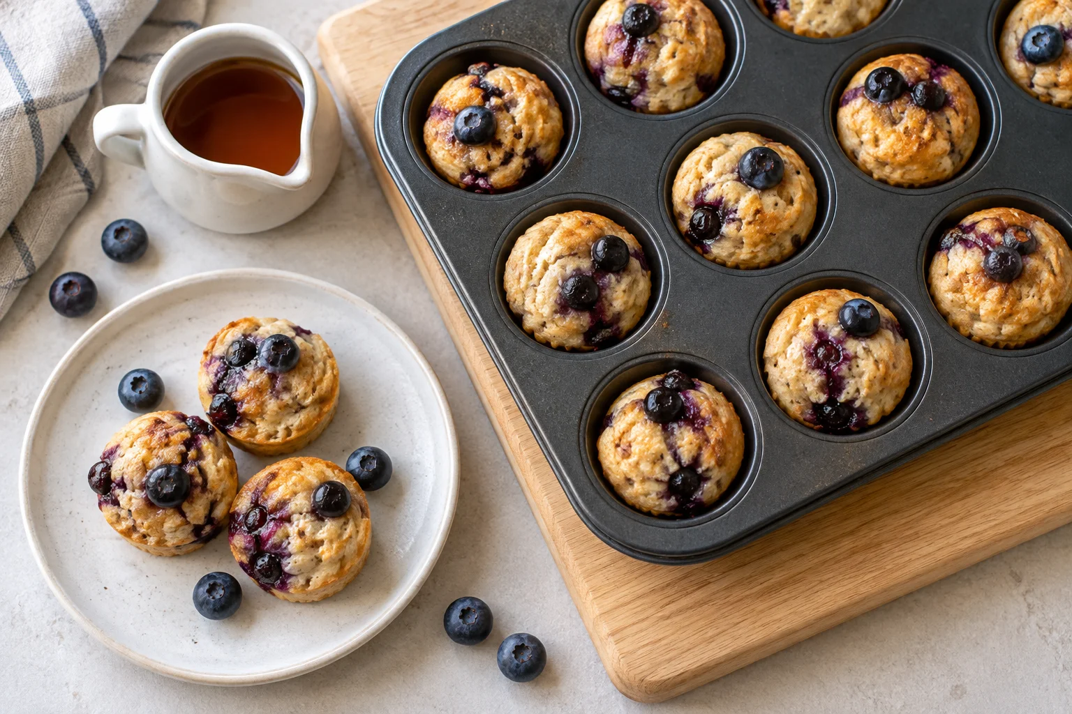 Mini muffin pan with golden cottage cheese pancake bites topped with blueberries